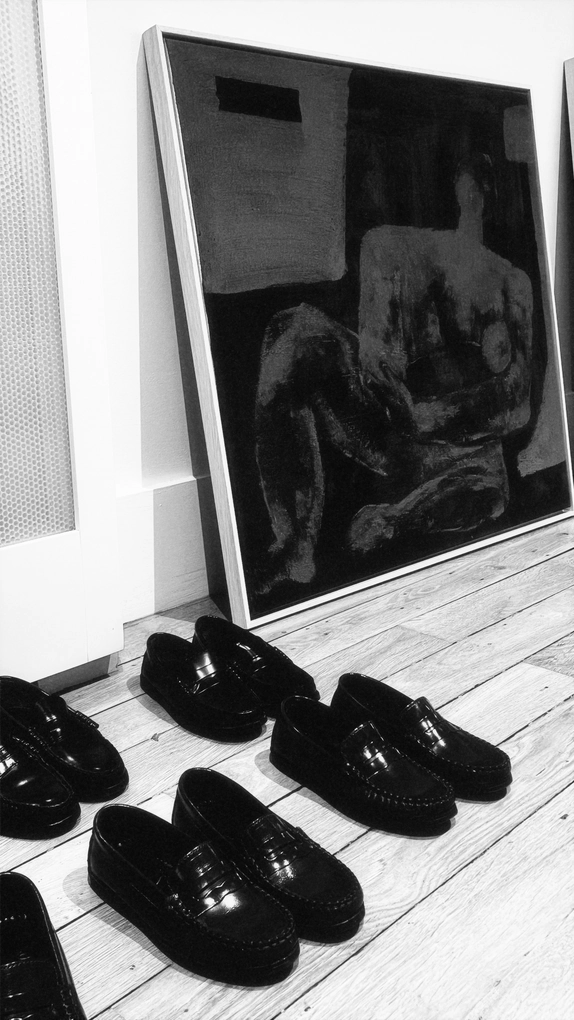 Editorial retail scene with shoes and artwork